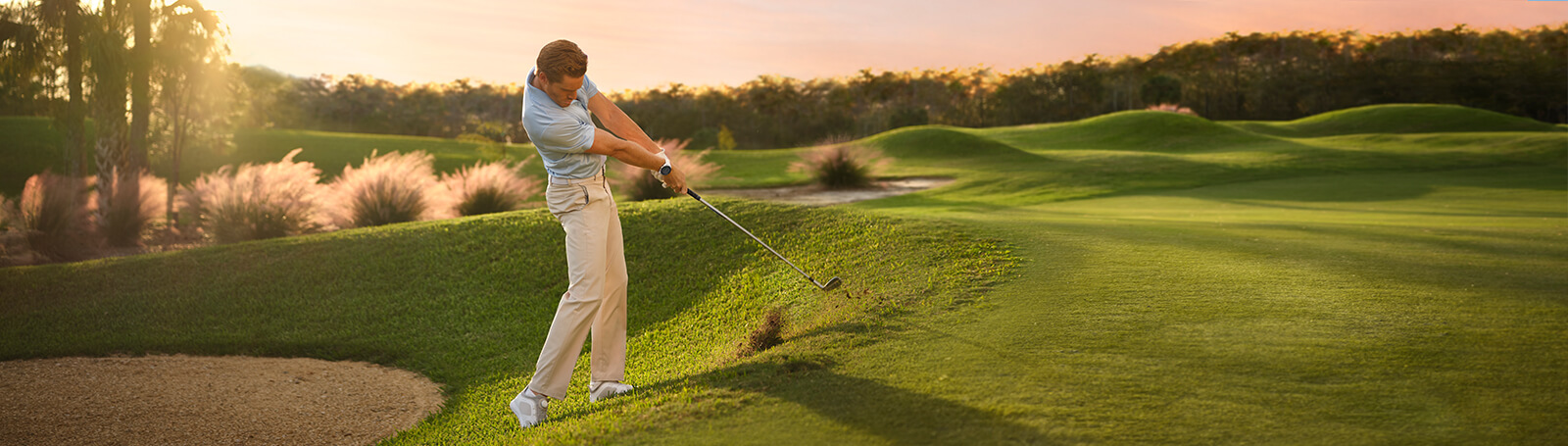 Golf Science - A man in blue shirt golfing